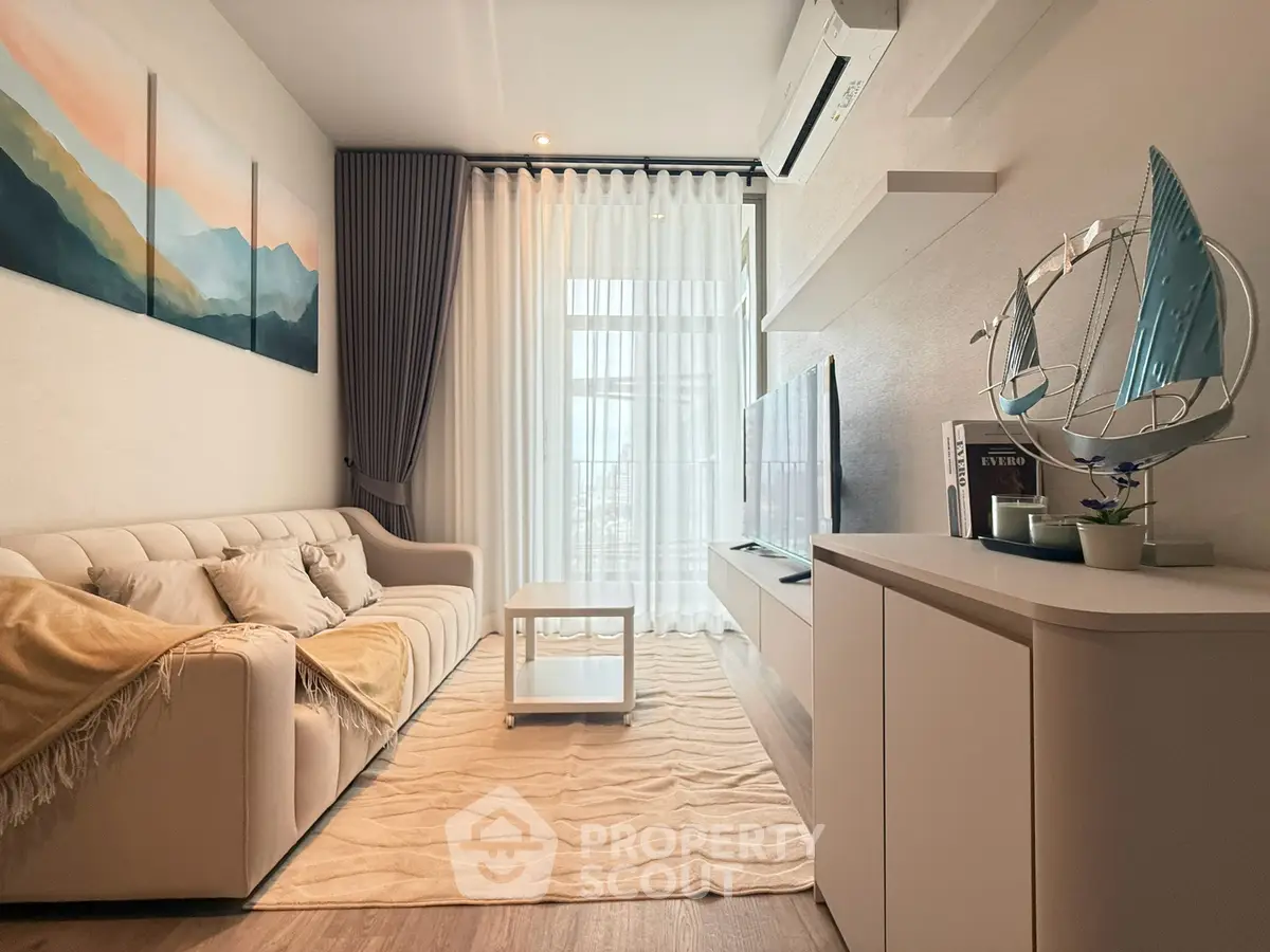 Modern living room with stylish decor, cozy sofa, and large window for natural light.