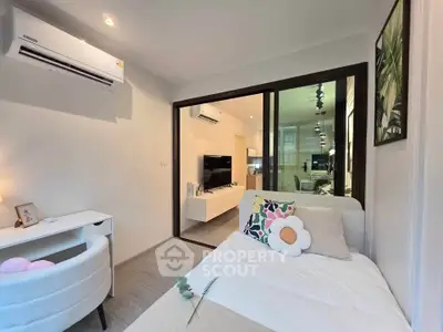 Modern bedroom with stylish decor and open view to living room