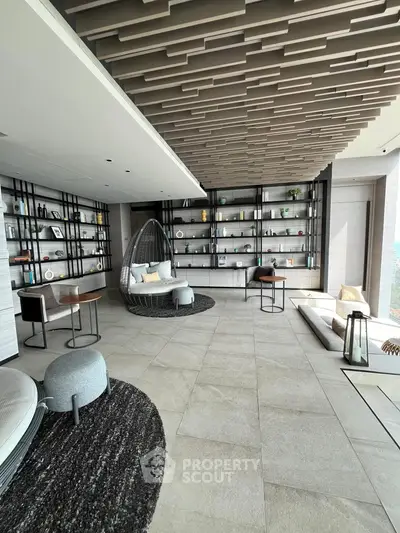 Luxurious modern living room with stylish decor and panoramic views, featuring unique ceiling design and elegant furnishings.