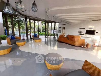 Luxurious modern lobby with stylish seating and elegant lighting, perfect for welcoming guests in a high-end building.