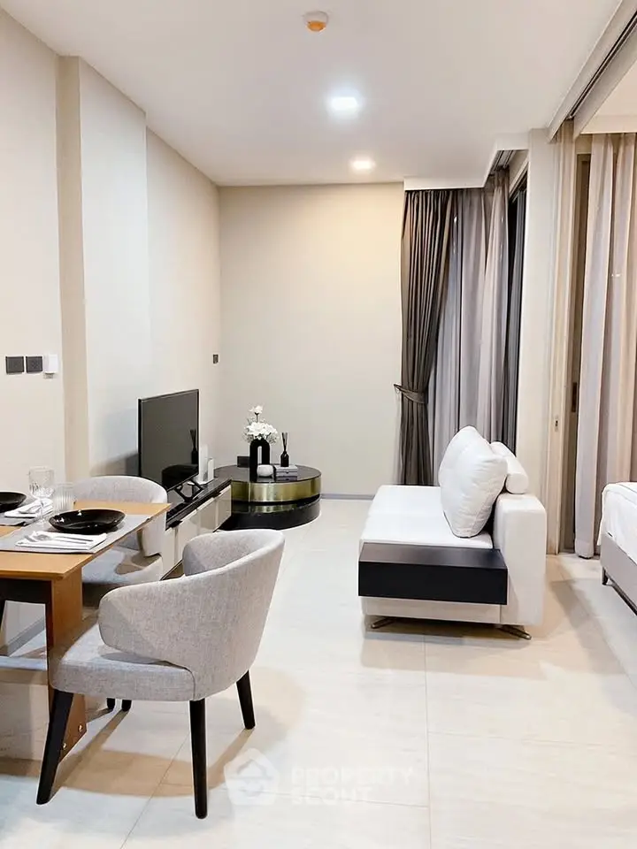 Modern living room with sleek furniture and neutral tones, perfect for urban living.