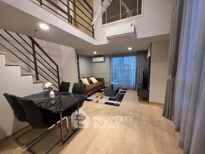 Modern duplex living room with stylish decor and open layout