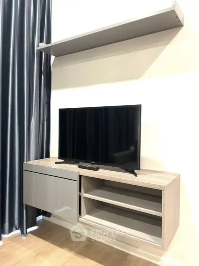 Modern living room with sleek TV stand and wall shelf