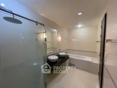Luxurious modern bathroom with dual sinks and spacious shower