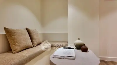 Cozy minimalist living room with built-in seating and stylish decor.