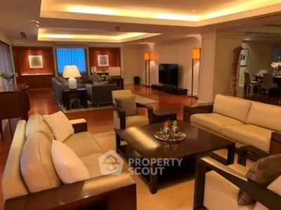 Luxurious living room with elegant furniture and ambient lighting in a spacious open layout.