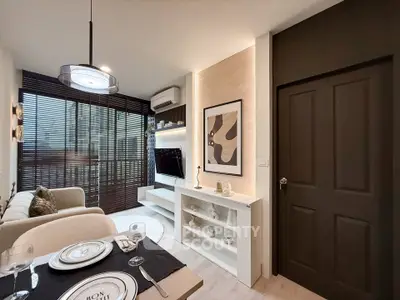 Modern living room with stylish decor and large windows for natural light