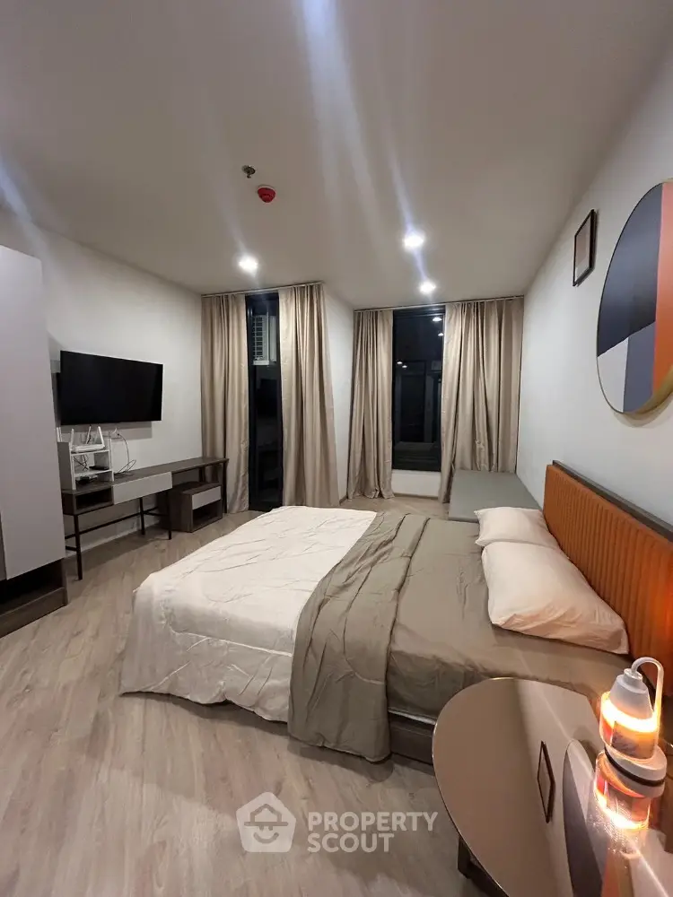 Modern bedroom with stylish decor and ambient lighting