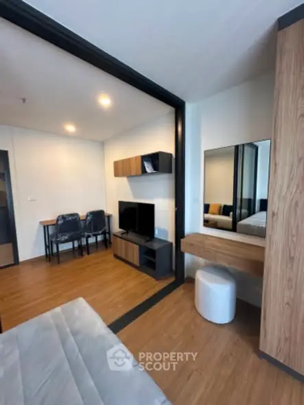 Modern studio apartment with open layout and stylish furnishings.