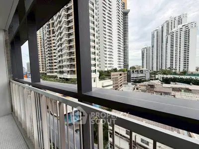 Stunning urban balcony view with modern high-rise buildings and cityscape.