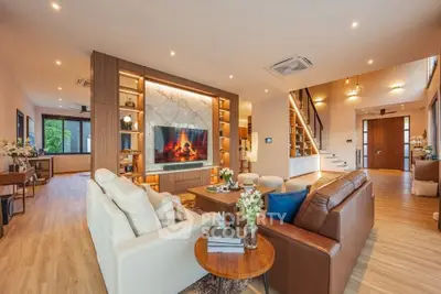 Luxurious open living room with modern decor and elegant lighting