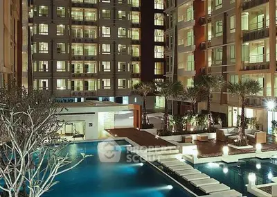 Luxurious apartment complex with stunning pool and modern architecture.