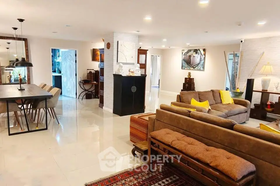Spacious modern living room with elegant dining area and stylish decor