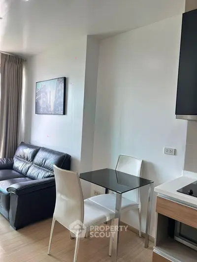 Modern living room with sleek furniture and natural light, perfect for urban living.