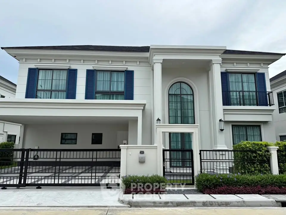Elegant two-story house with classic architecture and spacious driveway