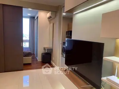 Modern apartment interior with sleek living room and cozy bedroom view
