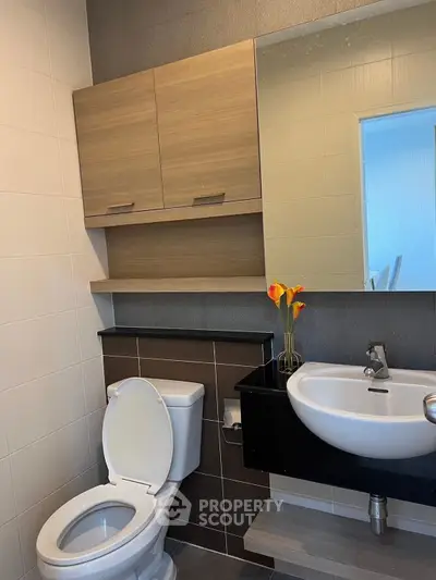 Modern bathroom with sleek fixtures and stylish cabinetry