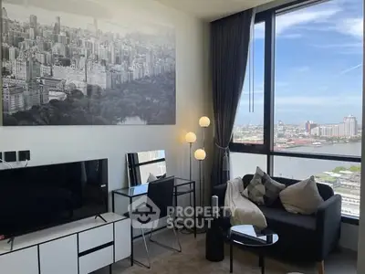 Modern living room with city view, stylish furniture, and large window for natural light.