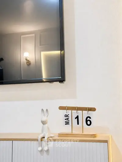 Modern living room with wall-mounted TV and stylish decor