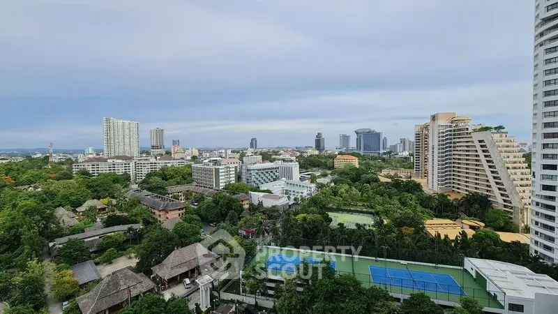 Stunning cityscape view with lush greenery and modern high-rise buildings