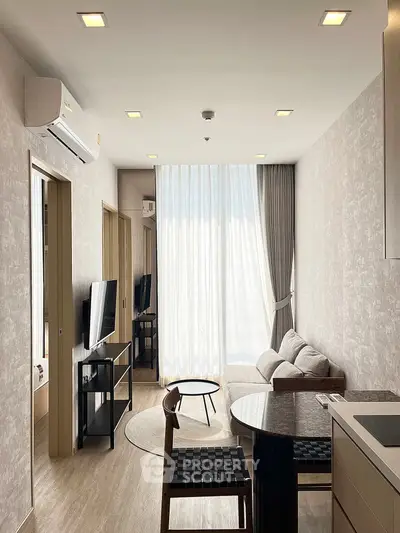 Modern living room with natural light and stylish furniture