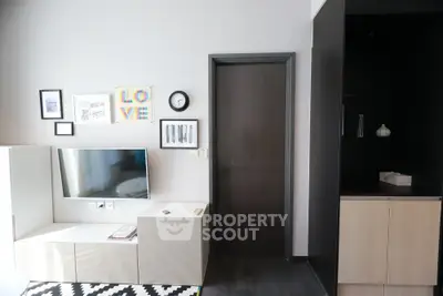 Modern living room with stylish decor and wall-mounted TV unit