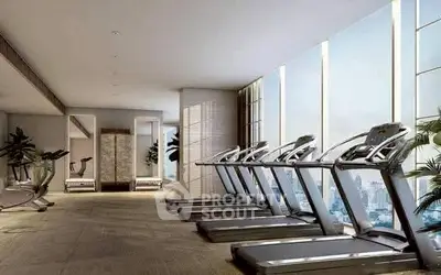 Luxurious gym with city view and modern treadmills in high-rise building.