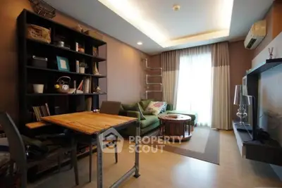 Modern living room with stylish furniture and natural light, featuring a cozy seating area and contemporary decor.