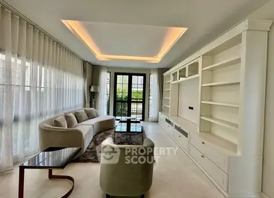 Luxurious living room with elegant furniture and large windows