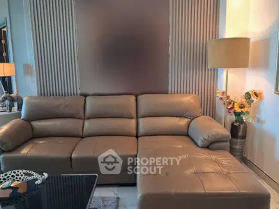 Luxurious living room with plush leather sectional sofa and elegant decor