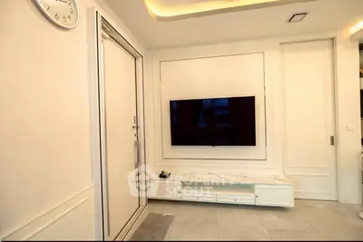 Modern living room with wall-mounted TV and elegant decor