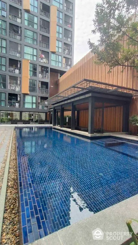 Modern condominium with luxurious swimming pool and stylish architecture