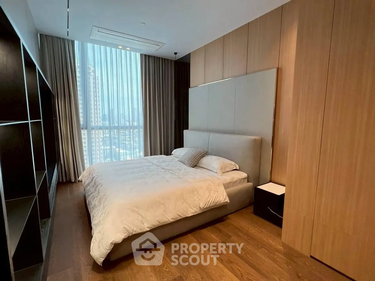 Luxurious modern bedroom with floor-to-ceiling window and wooden accents