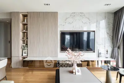 Luxurious modern living room with elegant decor and large TV