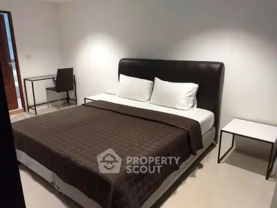 Modern bedroom with sleek design and comfortable king-size bed