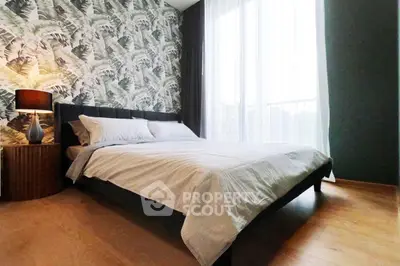 Stylish bedroom with tropical wallpaper and large window