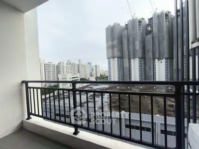 Spacious balcony with cityscape view, perfect for urban living enthusiasts.