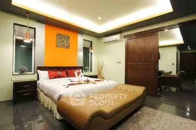 Luxurious bedroom with modern decor and ambient lighting
