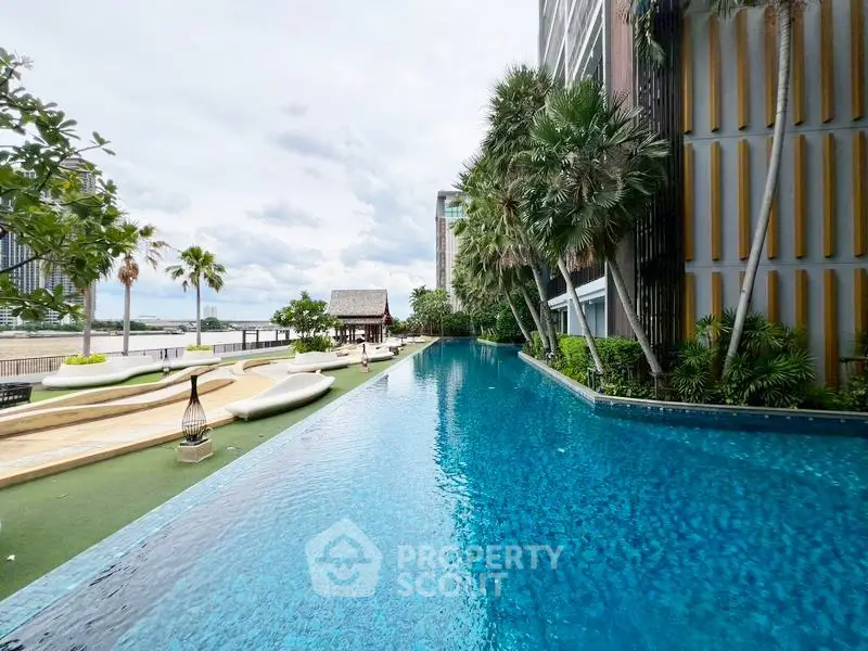 Luxurious condominium with stunning poolside view and lush greenery
