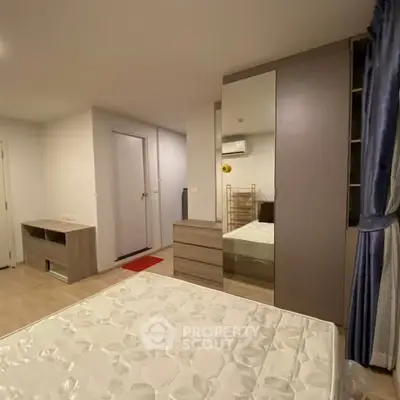 Modern bedroom with stylish furniture and ample storage space