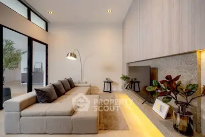 Modern living room with sleek design, cozy sofa, and ambient lighting.