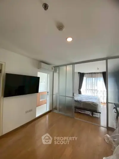 Modern apartment with sliding glass doors and spacious bedroom