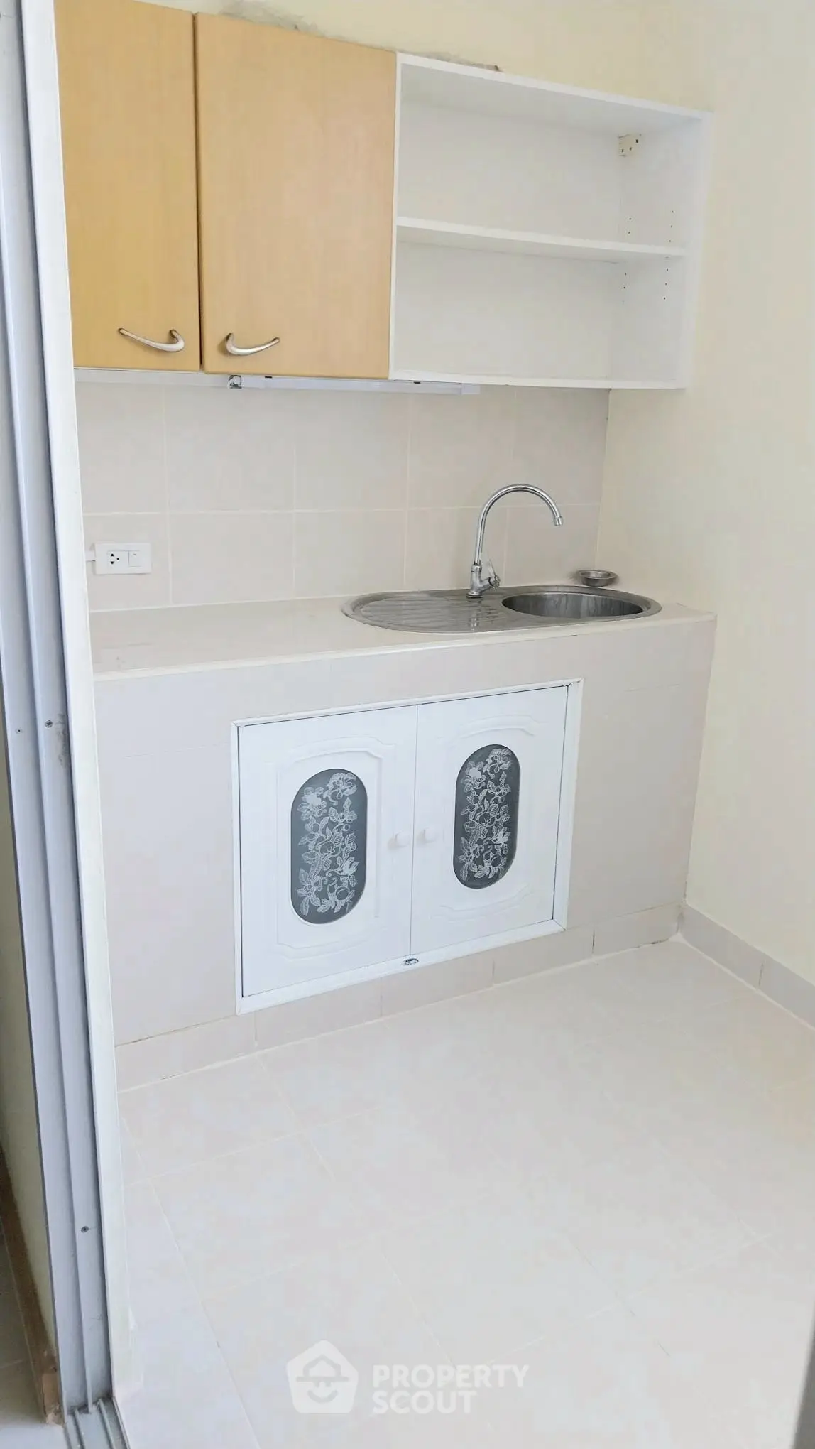 Compact kitchen with minimalist design and dual sink setup