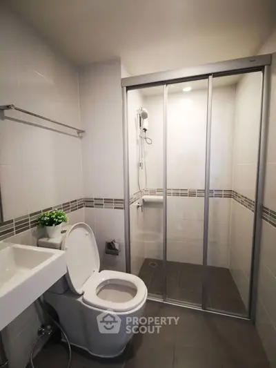 Modern bathroom with sleek shower enclosure and contemporary fixtures