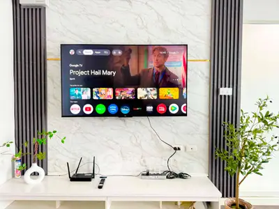 Modern living room with wall-mounted TV and stylish decor