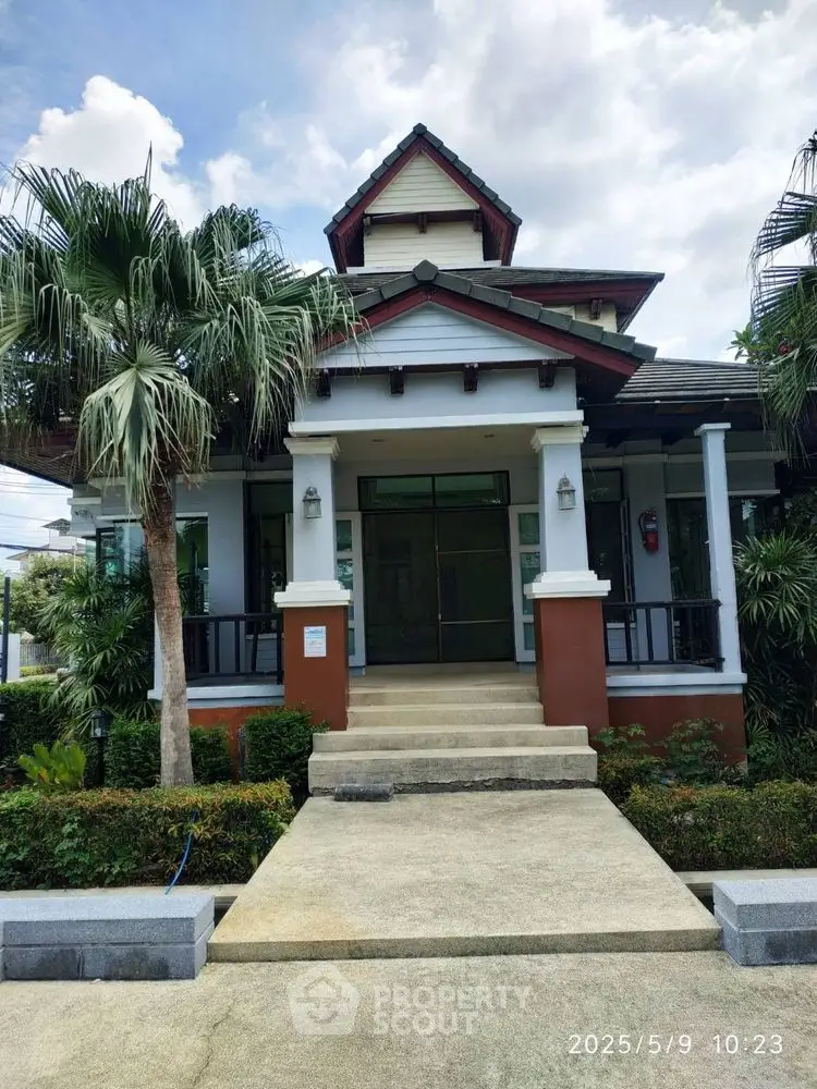 Charming residential building with lush greenery and inviting entrance