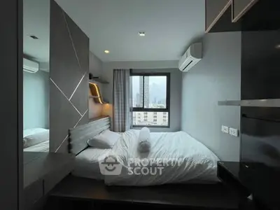 Modern bedroom with city view, featuring sleek design and cozy ambiance.