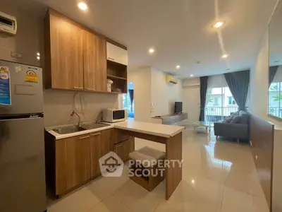 Modern open-plan kitchen and living room with sleek design and natural light