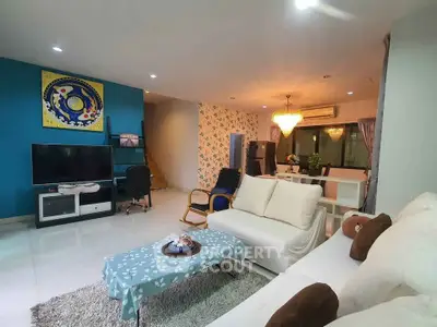Spacious modern living room with stylish decor and open layout, perfect for family gatherings.
