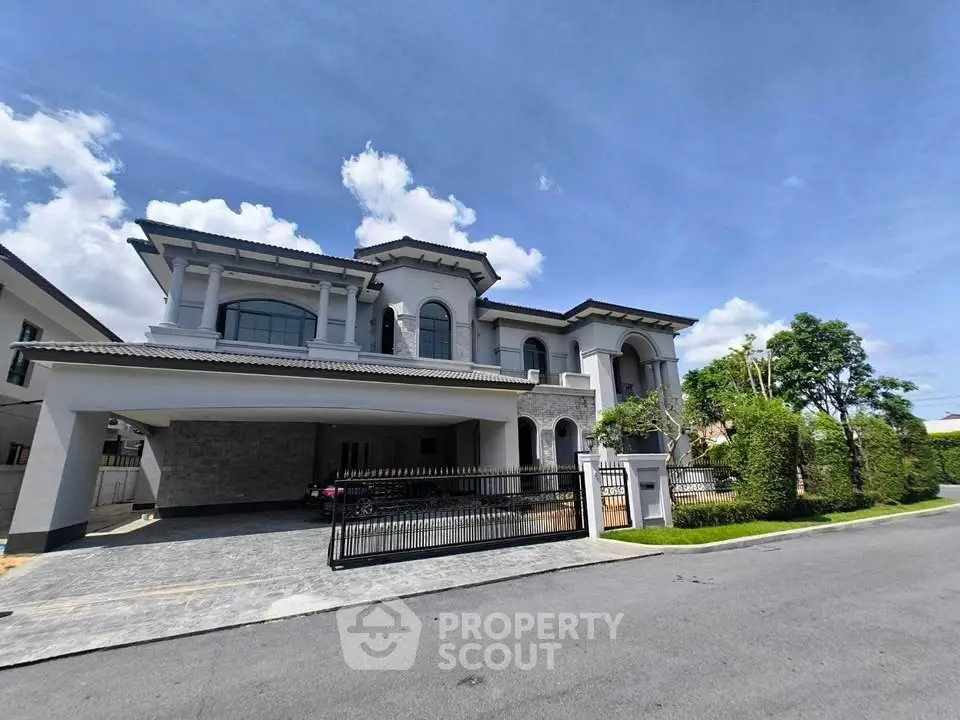 Luxurious two-story mansion with elegant facade and spacious driveway in a serene neighborhood.